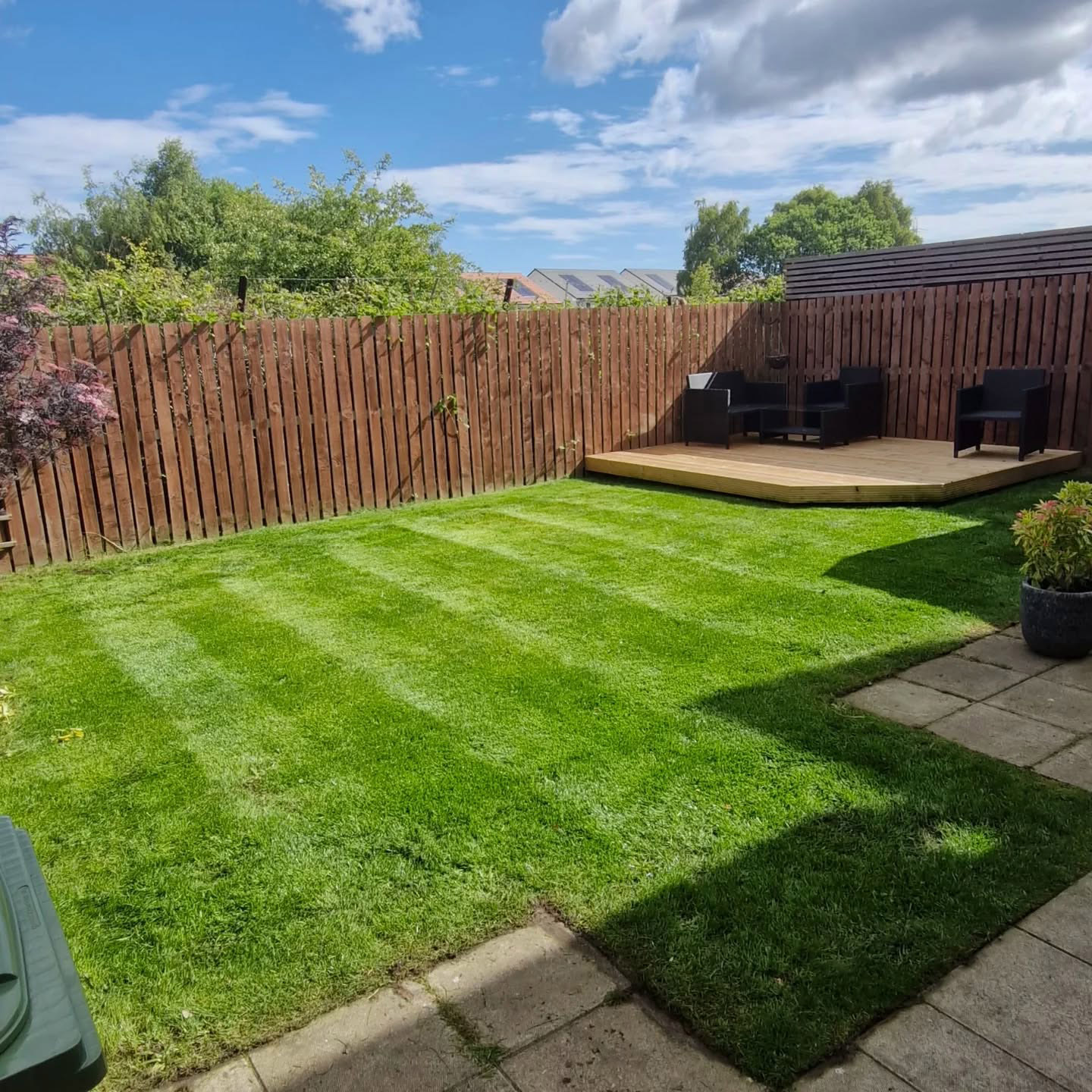 Landscaping after: new lawn, path and decking