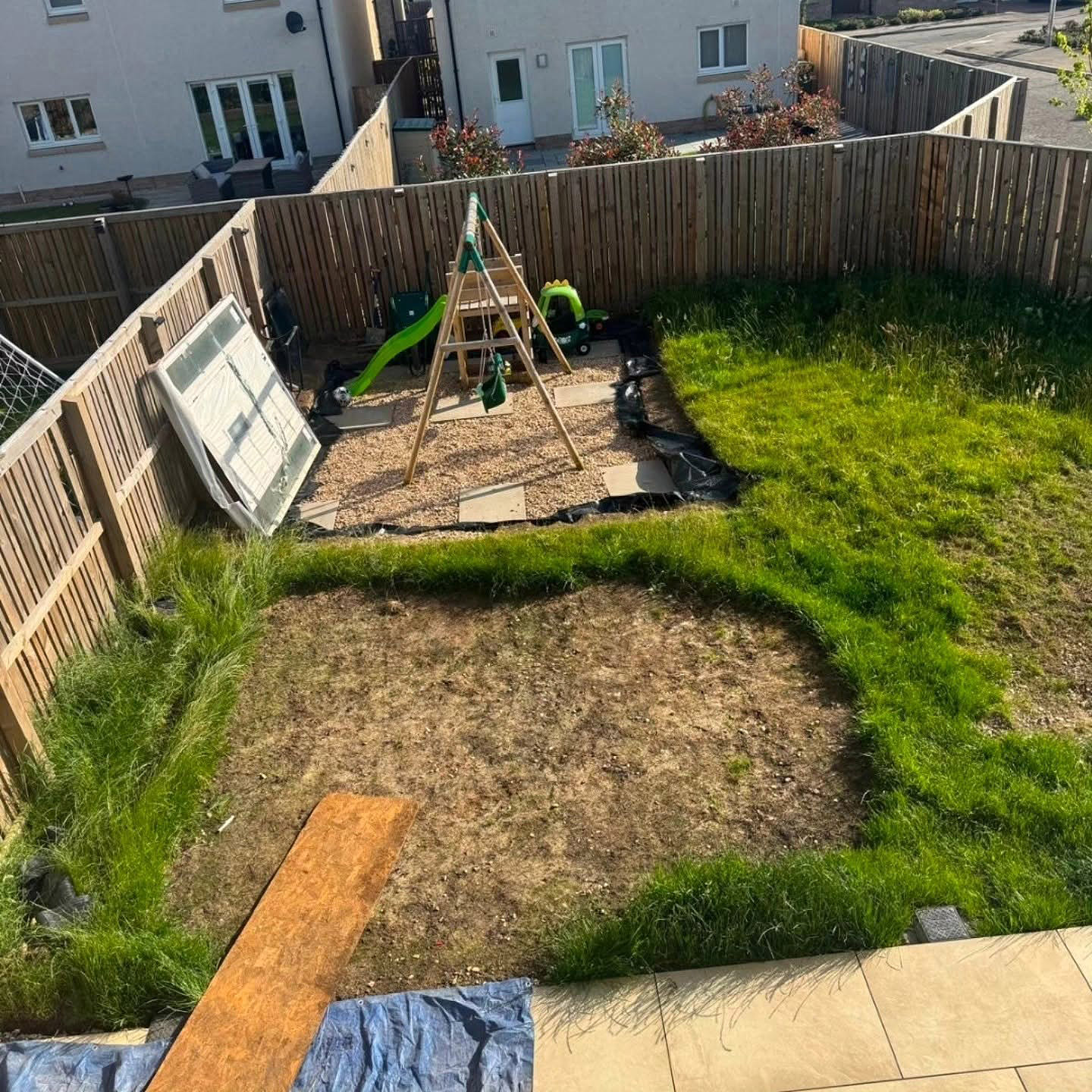 Tired lawn in a Bonnyrigg garden seen from above before work started