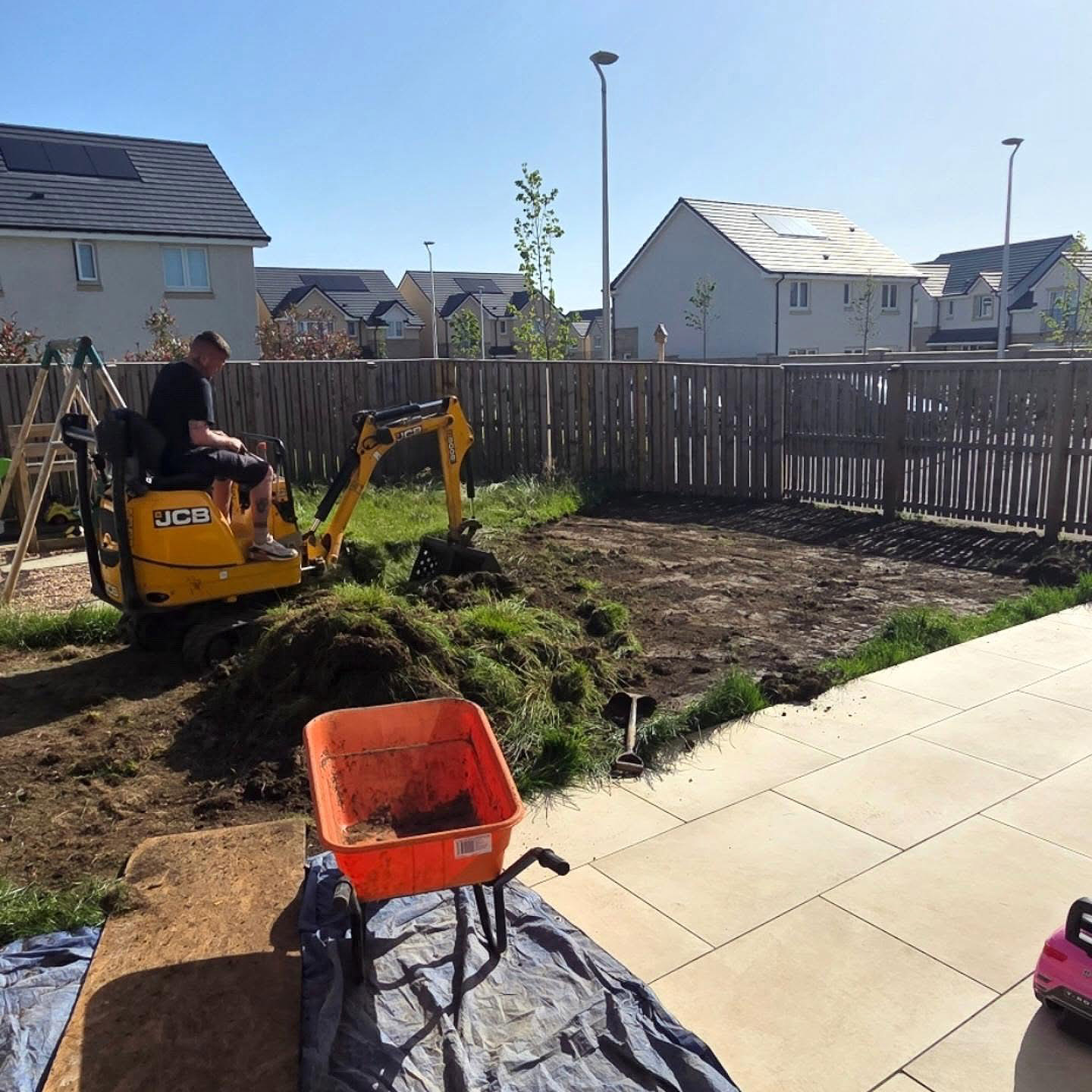 Mini digger stripping out the old lawn in a Bonnyrigg garden