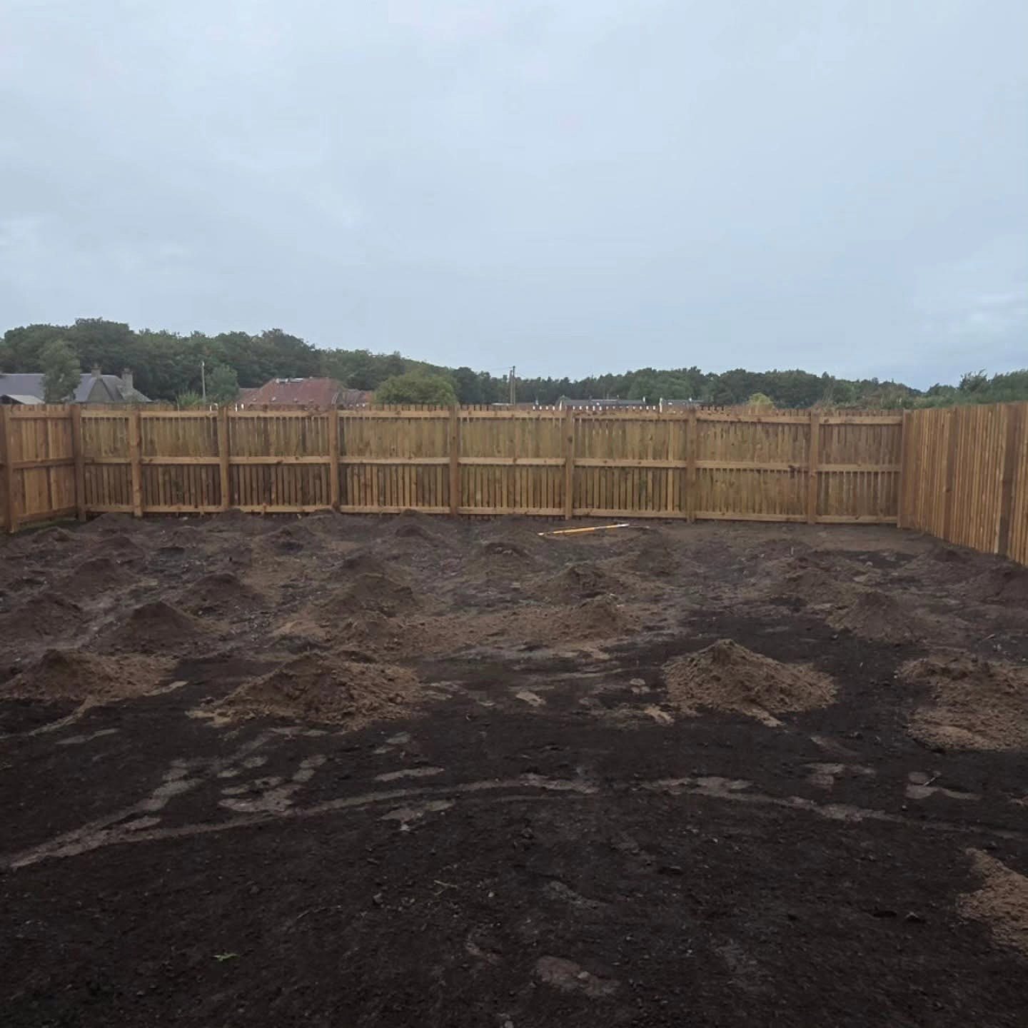 Topsoil spread across the old lawn in a Whitecraig garden